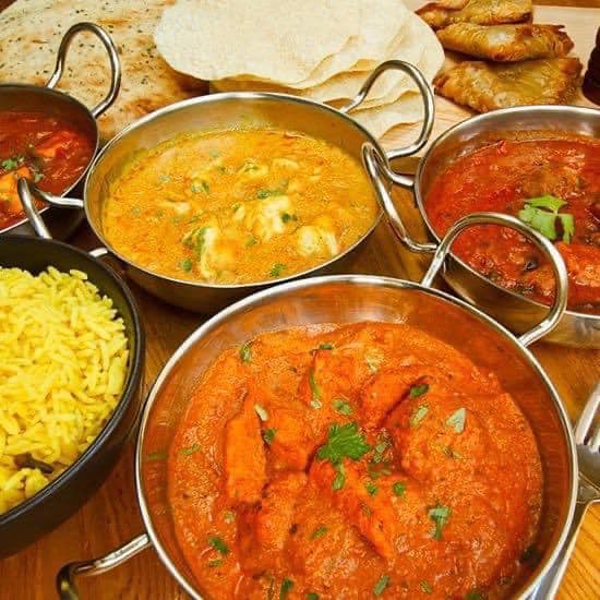 a variety of creamy curries served at Village Takeaway in Glenboig