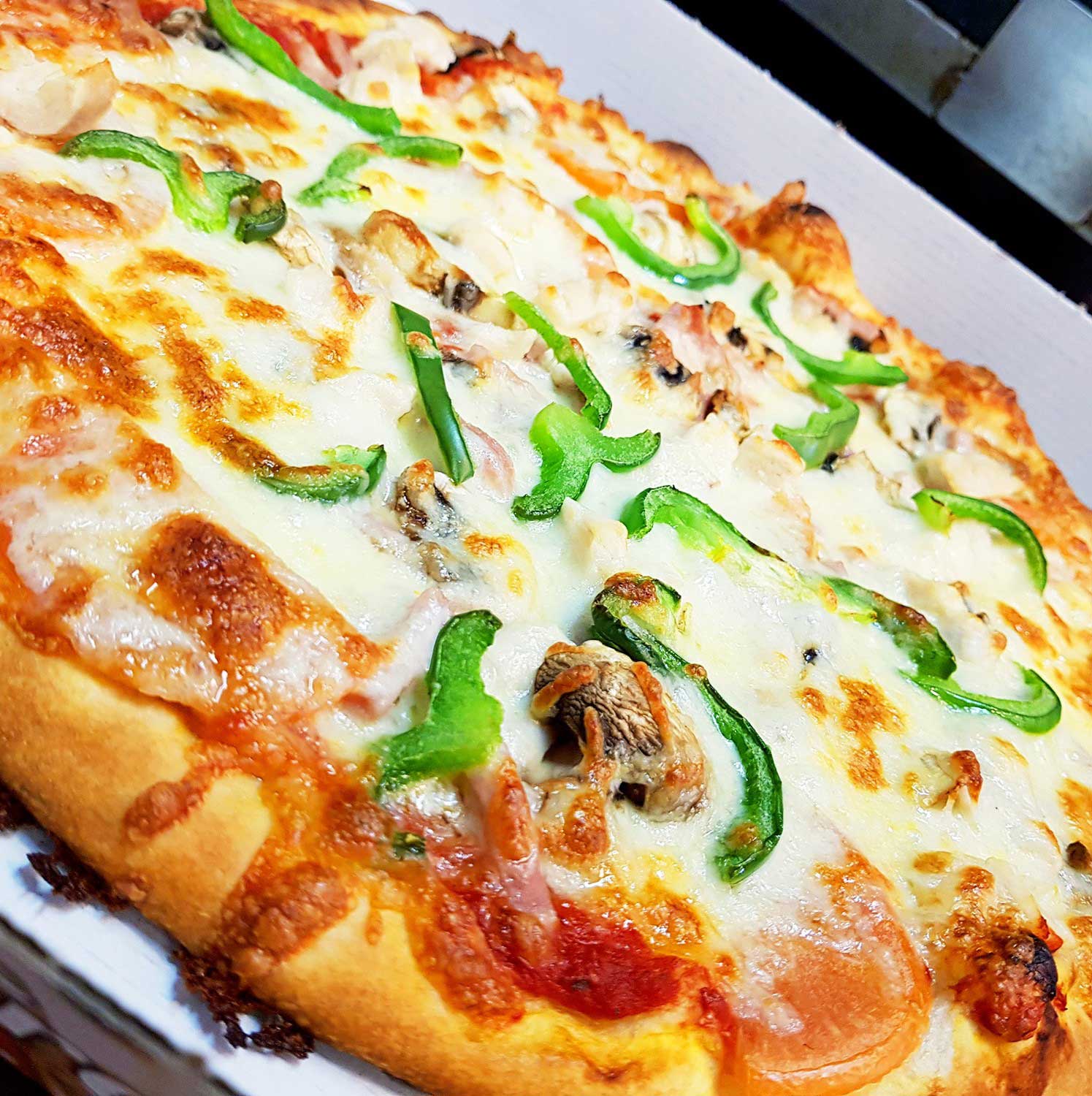 Freshly made pizzas served at Village Takeaway in Glenboig