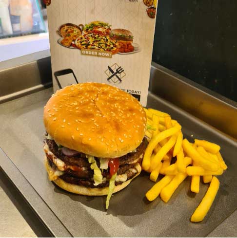 Juicy burgers with chips served at Village Takeaway in Glenboig