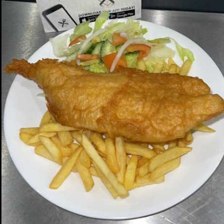 Crispy fish & chips with salad served at Village Takeaway in Glenboig